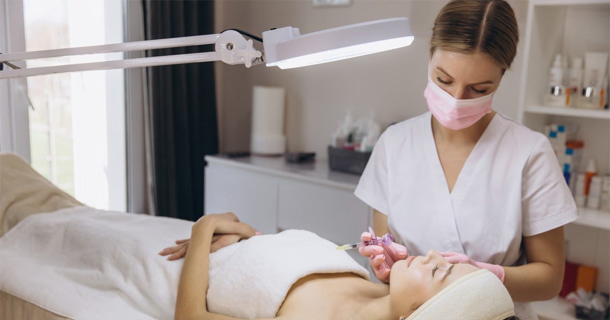 First-time patient learning what to expect from dermal fillers during consultation