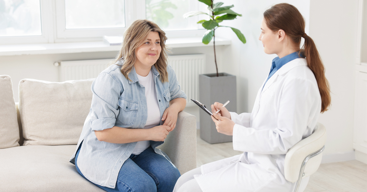 Woman learning about GLP-1 weight loss treatment and healthy long-term weight management support